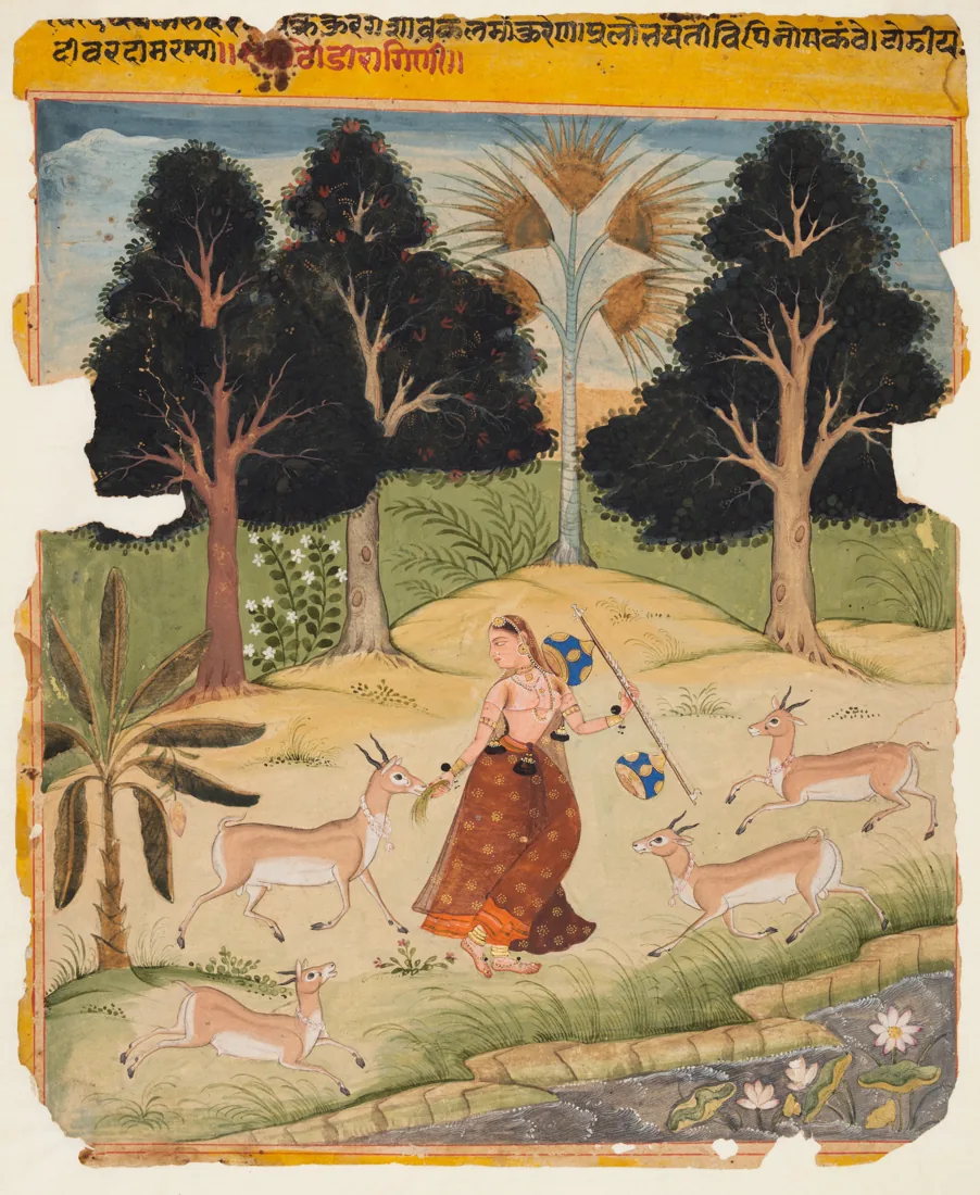 A Rajput painting: a woman in a red skirt feeds a deer in a wooded landscape.
